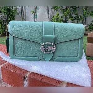 Coach Mint Green Pebbled Leather Clutch with Horse & Carriage Logo
